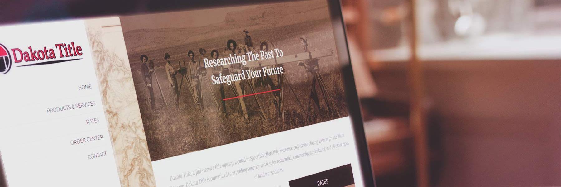 Dakota Title website on laptop