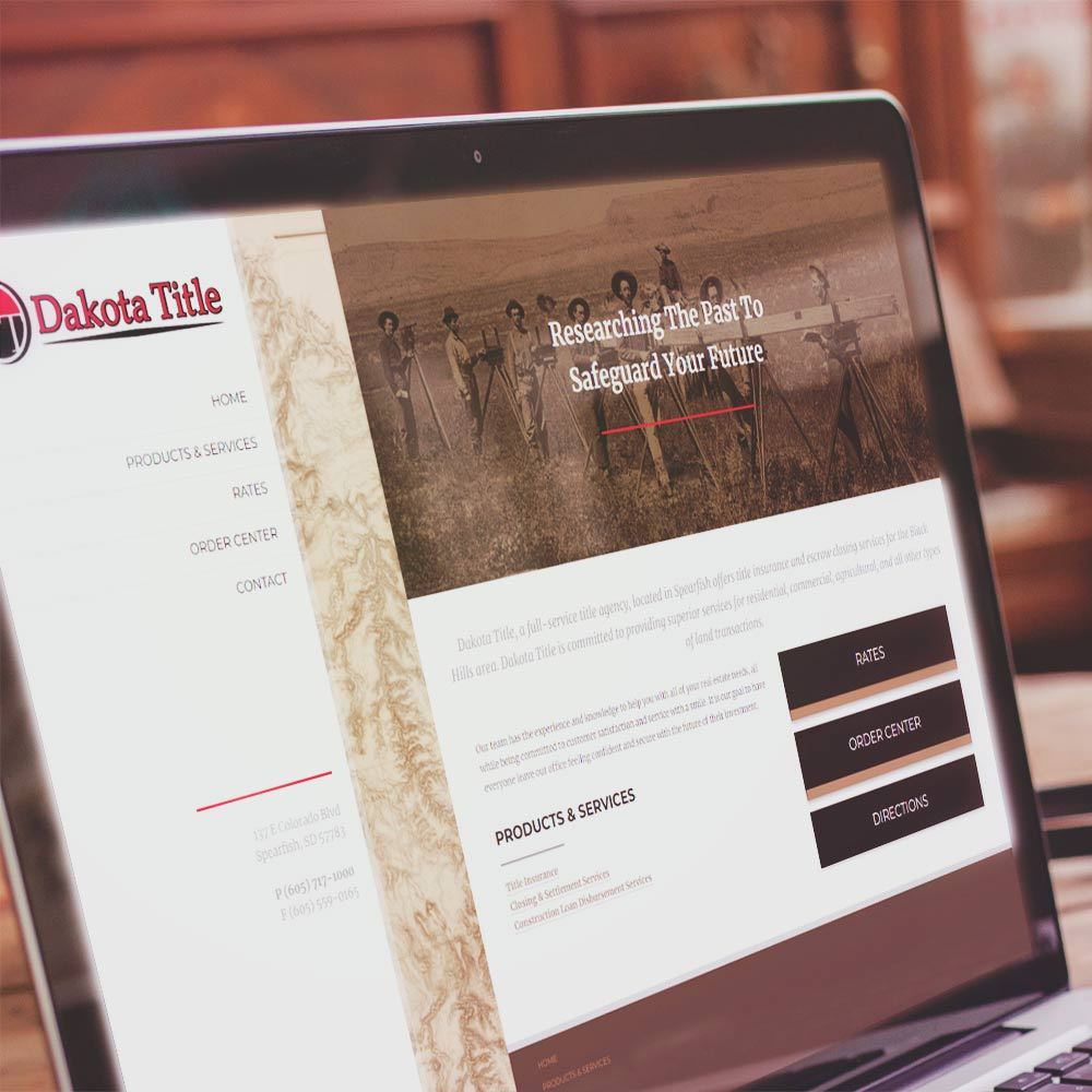 Dakota Title website on laptop