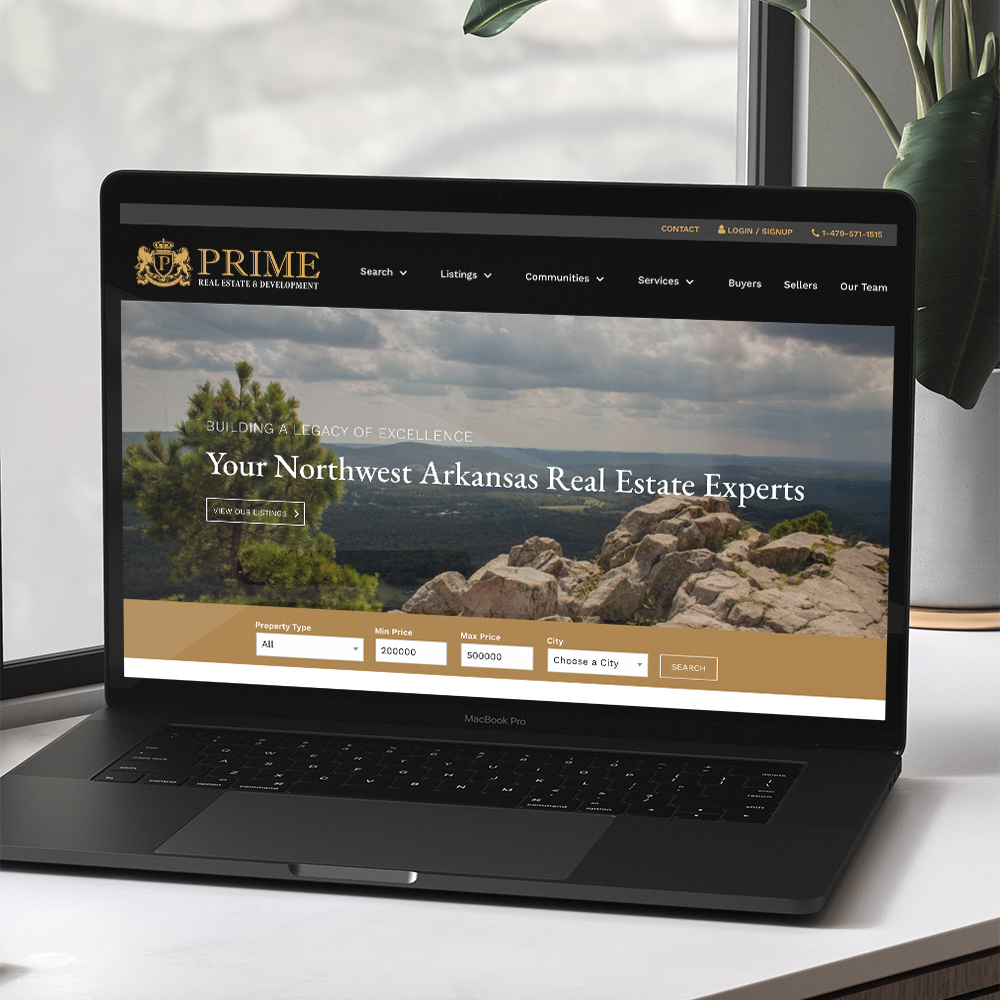 Prime Real Estate & Development website homepage on laptop